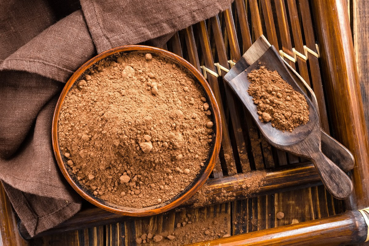 A spoonful of rich, antioxidant-packed raw cacao powder, perfect for smoothies, baking, and hot chocolate.