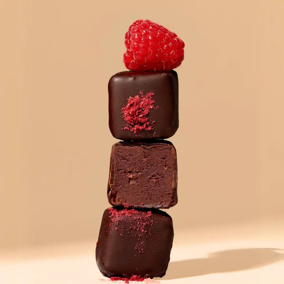 Vegan raspberry chocolate truffles – coffee-infused ganache with a crunchy roasted coffee bean topping.